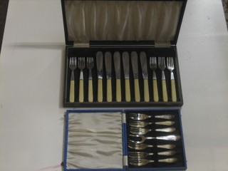 A set of 6 silver plated fish knives and forks and a set of 6 pastry knives and forks, cased