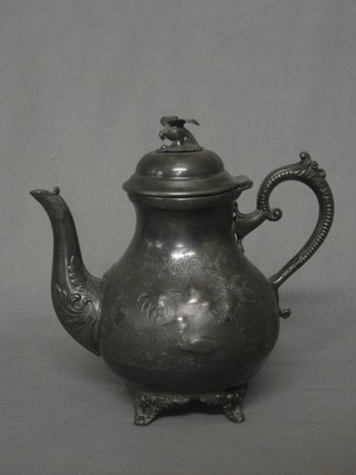 An embossed Britannia metal teapot