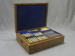 A canteen of Old English silver plated flatware contained in an oak canteen box