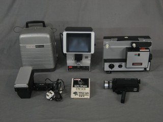 A Bell and Howell Super 8 movie projector, 2 projectors, an edit machine and other photographic equipment