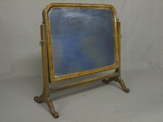 A Queen Anne style arched plate dressing table mirror contained in a walnut swing frame 12"