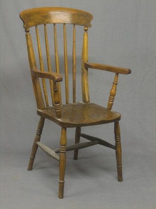 A 19th/20th Century elm stick and  bar back kitchen Windsor carver chair