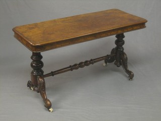 A Victorian figured walnut stretcher table, raised on turned supports 35" (cut down)
