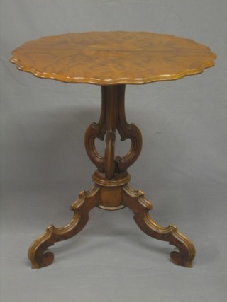 A handsome 19th Century burr walnut circular snap top wine table, raised on a pierced column and tripod base with pie crust edge 26"