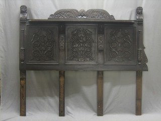An 18th/19th Century carved oak panel converted for use as a headboard 63"