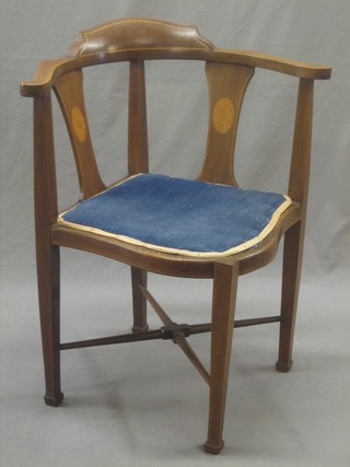 An Edwardian inlaid mahogany corner chair raised on square tapering supports with X framed stretcher