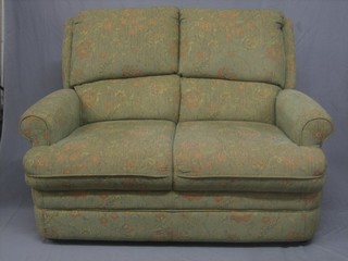 A modern 2 seat sofa upholstered in floral patterned material 47"
