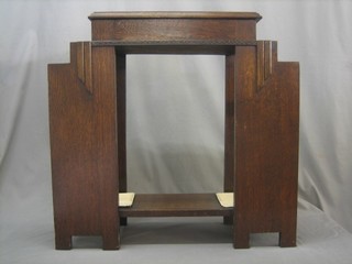 An Art Deco oak umbrella stand with hinged glove box, the base fitted 2 drip trays 13"