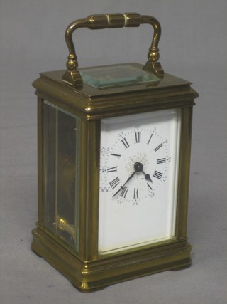 A 19th Century French 8 day carriage clock with Roman numerals contained in a gilt metal case