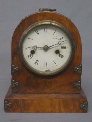 A 19th Century striking mantel clock with painted dial and Roman numerals contained in an arch shaped case