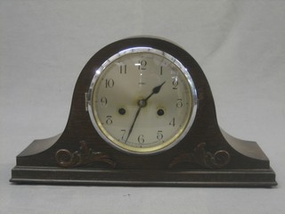 A 1930's chiming mantel clock contained in an oak Admiral's hat shaped case
