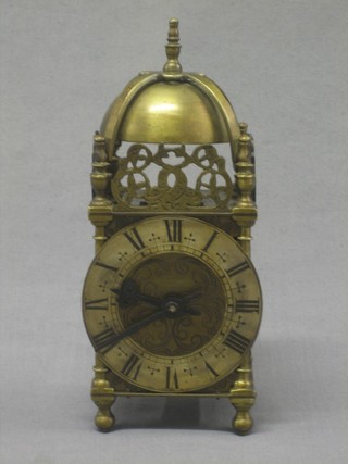 A 1930's reproduction 17th Century style lantern clock by Davall contained in a gilt metal case 7"