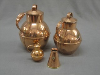 3 graduated Guernesey copper milk canisters and a waisted copper pail