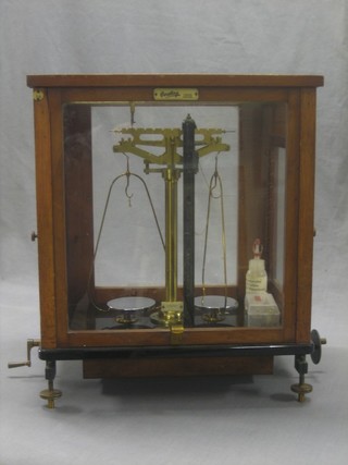 A laboratory balance contained in a mahogany case