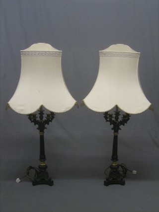 A handsome pair of Regency style bronze and gilt Ormolu table lamps in the form of a pair of 5 light candelabrum raised on octagonal columns with scrolled feet 26"