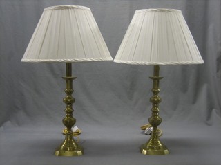 A pair of 19th brass candlesticks with knopped stems converted to electric table lamps 14"