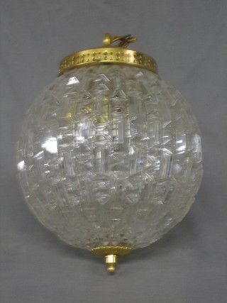 A globular shaped cut glass light fitting