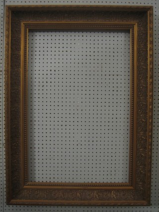 A large gilt picture frame 37" x 27"