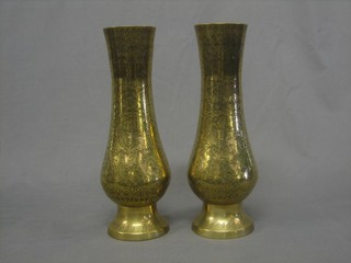 A pair of engraved Benares brass club shaped vases 11"