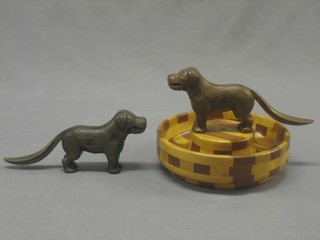 A pair of steel nut crackers in the form a Labrador 10" together with a circular nut bowl