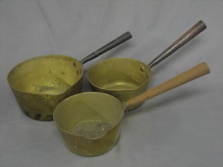 3 19th Century graduated brass saucepans with iron handles