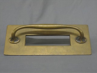 A large 1930's brass letter box incorporating a handle 15"