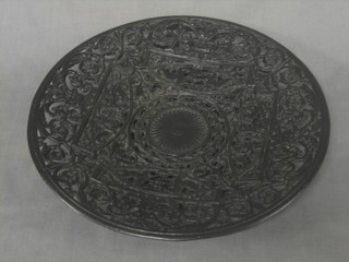 A 19th Century pierced iron charger with classical decoration 11"