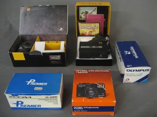 A Kodak Advantic boxed, an Olympus 335 Electron Senior, a Kodak Instamatic M14, an Olympus Newpic Zoom 90 and a Premier Zoom M6000, all boxed