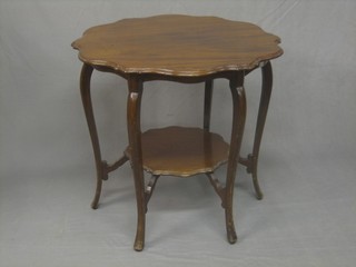 An Edwardian circular walnut 2 tier occasional table, raised on cabriole supports 30"