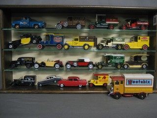 19 various toy cars including Matchbox models of Yesteryear etc, contained in an oak display cabinet