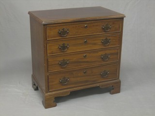 A Georgian style mahogany chest of 4 long drawers, raised on bracket feet 25"