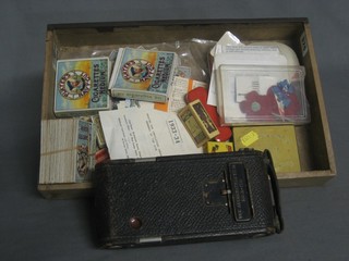 A Kodak folding camera and a collection of various curios etc