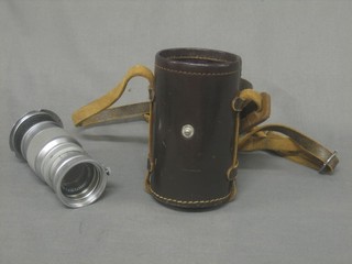 A Leica lens contained in a leather case