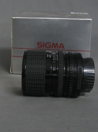 A Sigma 27/70mm lens, boxed