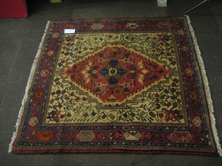 A contemporary north west Persian rug with diamond shaped medallion to the centre and with floral panels 58" x 58"