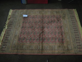A contemporary Bokhara style rose ground Belgian cotton carpet 67" x 49"