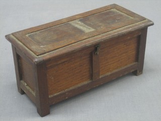 An oak trinket box in the form of a coffer 9"