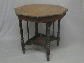 A Victorian octagonal inlaid rosewood 2 tier occasional table raised on turned supports 30"