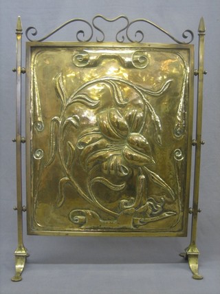 An Art Nouveau embossed brass fire screen 20"