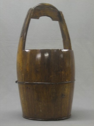 A bucket with wooden handle