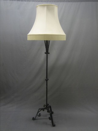 A Victorian wrought iron standard lamp