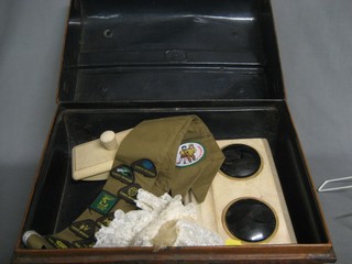 A rectangular metal trunk containing a Brownies sash with various badges and a leather blotter etc