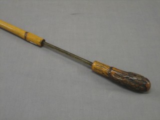 A 19th Century Malaca sword stick with 18" blade contained in a Malaca case