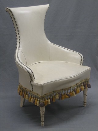 A Spanish style chair upholstered in white rexine