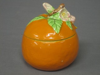 A Clarice Cliff preserve jar in the form of an orange 4"
