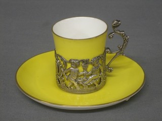 A yellow glazed Paragon coffee can, contained in a silver mount complete with saucer