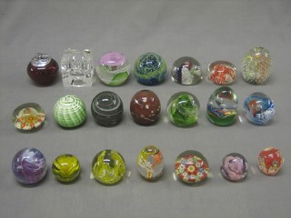 A collection 21 various glass paperweights