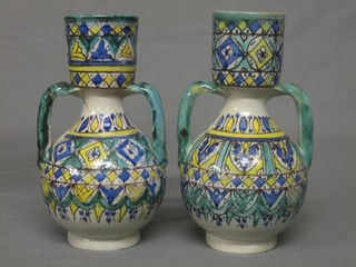 A pair of Ismic style pottery twin handled vases 9"