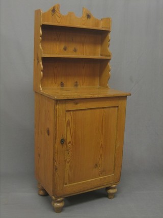 A Victorian pine chiffonier with raised back, the base fitted a cupboard enclosed by a panelled door 22"