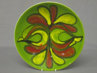 A circular 1960's Poole Pottery dish the base with Dolphin mark, marked Poole England 4 AT 10"